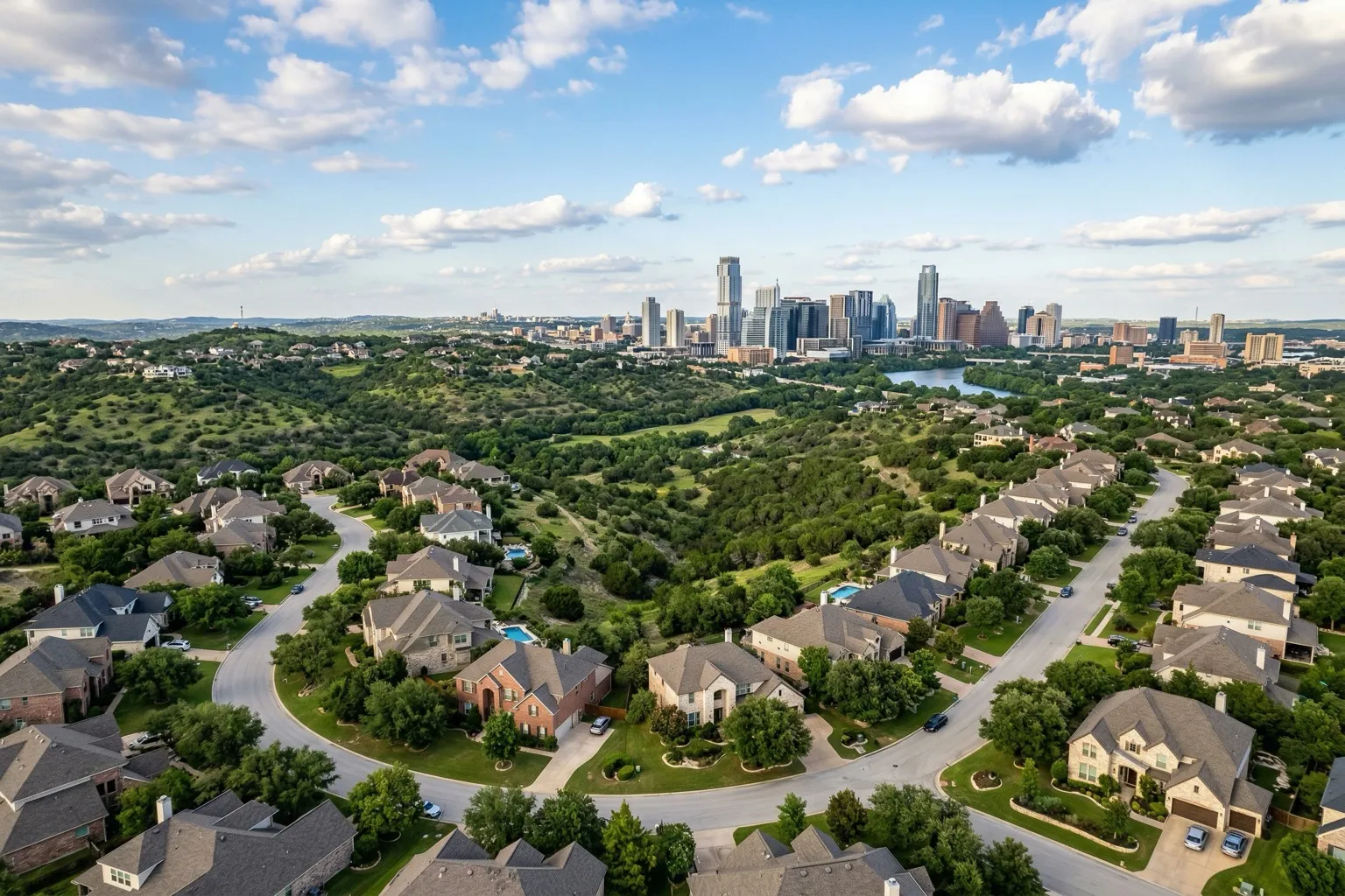 Austin Texas skyline with suburban residential neighborhoods and Hill Country rolling green hills