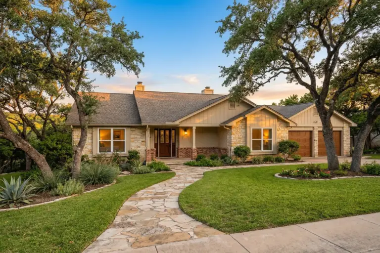 Row of single-family investment rental homes in Round Rock Texas suburb with stone exteriors and mature live oak trees