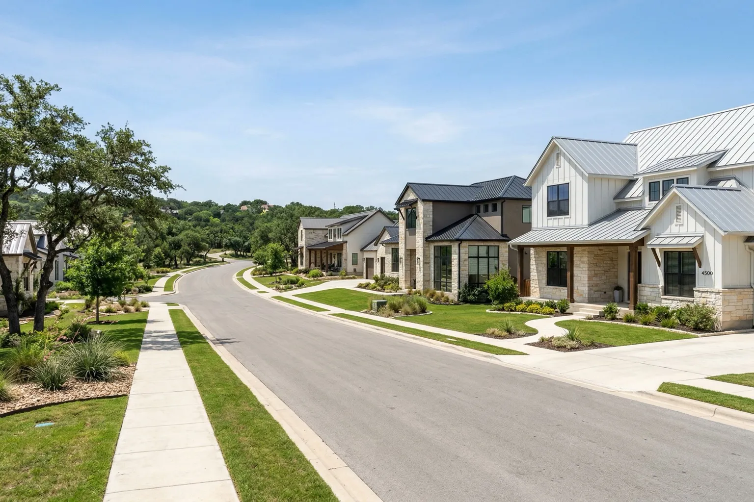 New construction suburban homes with modern farmhouse and contemporary architecture in Austin Texas Hill Country on a sunny day