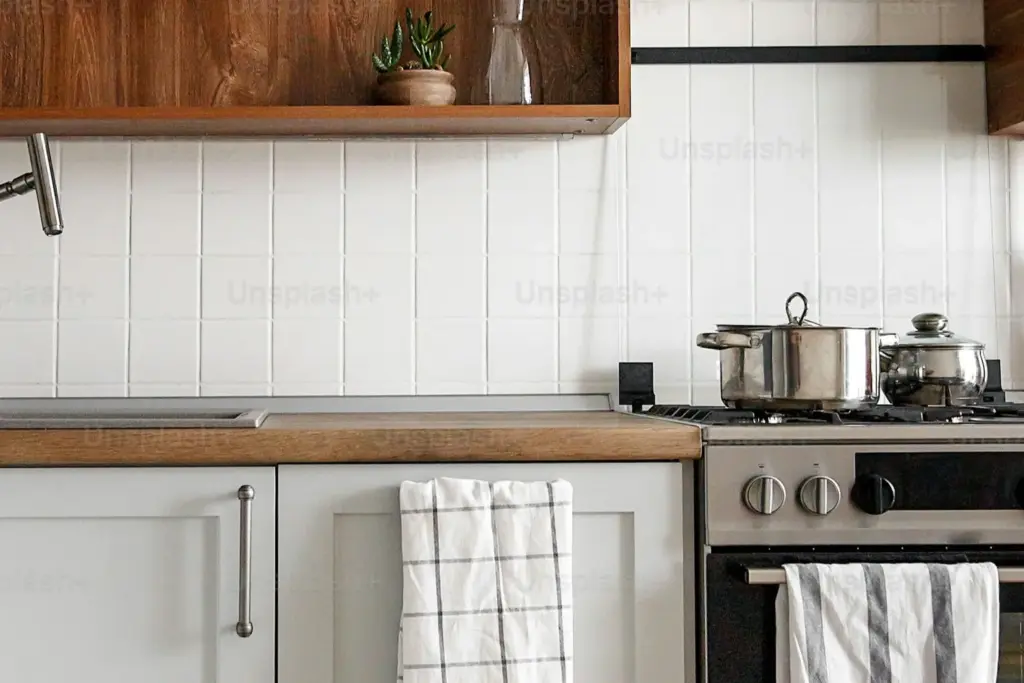 Modern kitchen renovation in an Austin home showing quartz counters and updated cabinetry