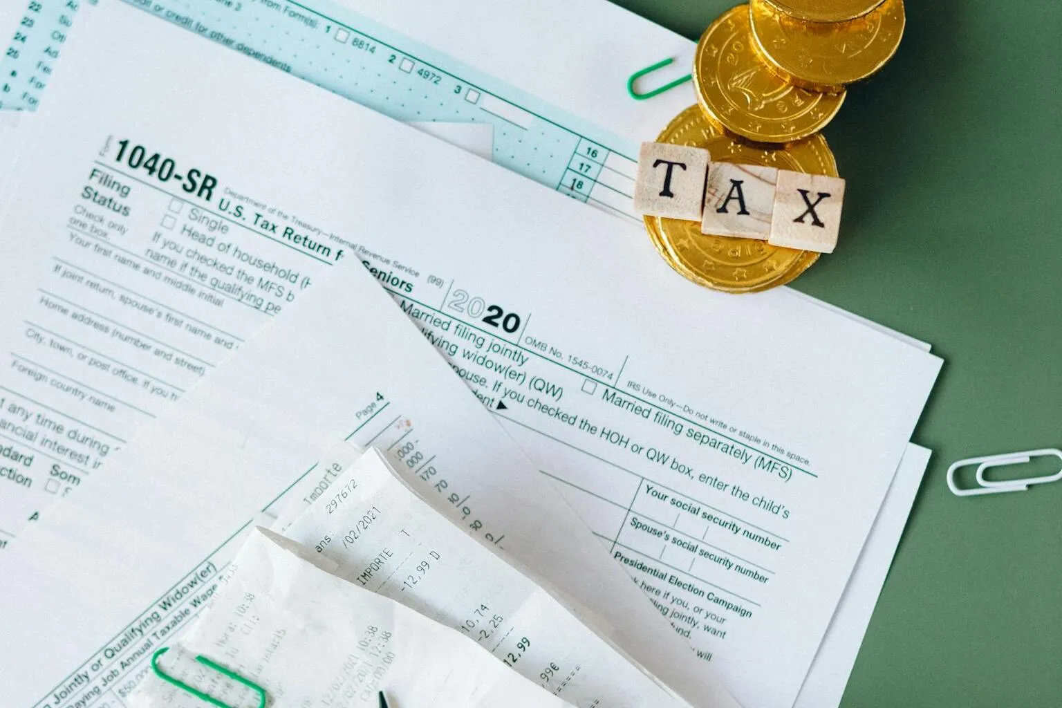 Tax documents and calculator on a desk for mortgage refinance planning