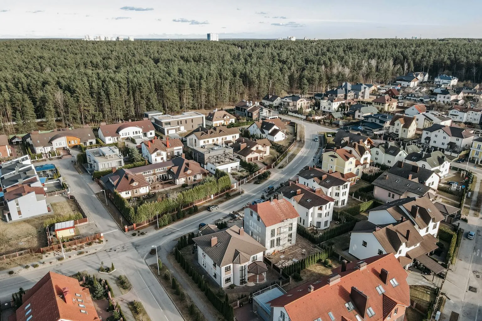 Aerial view of suburban neighborhood homes showing property lines and residential lots