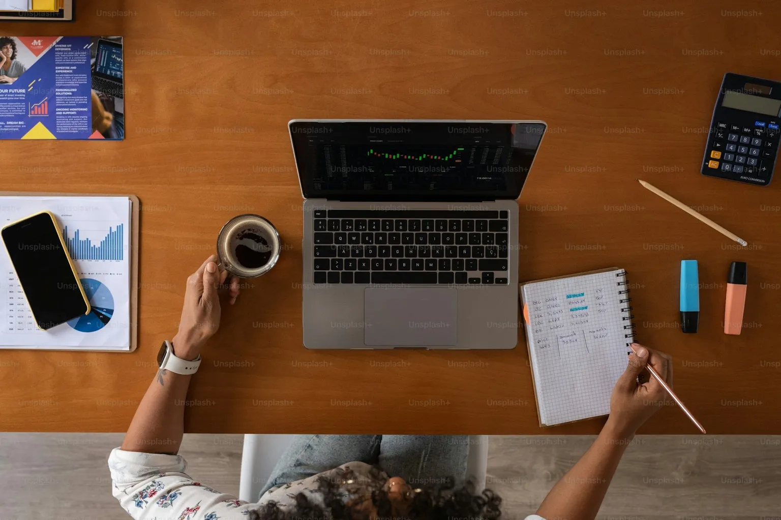 Realtor at desk reviewing a Claude AI morning brief with coffee