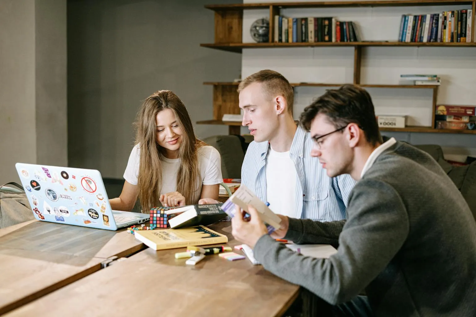 Two professionals working together at a modern coworking desk