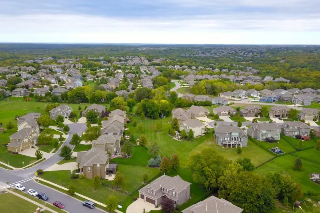 Aerial view of suburban residential neighborhood showing various housing densities and lot sizes