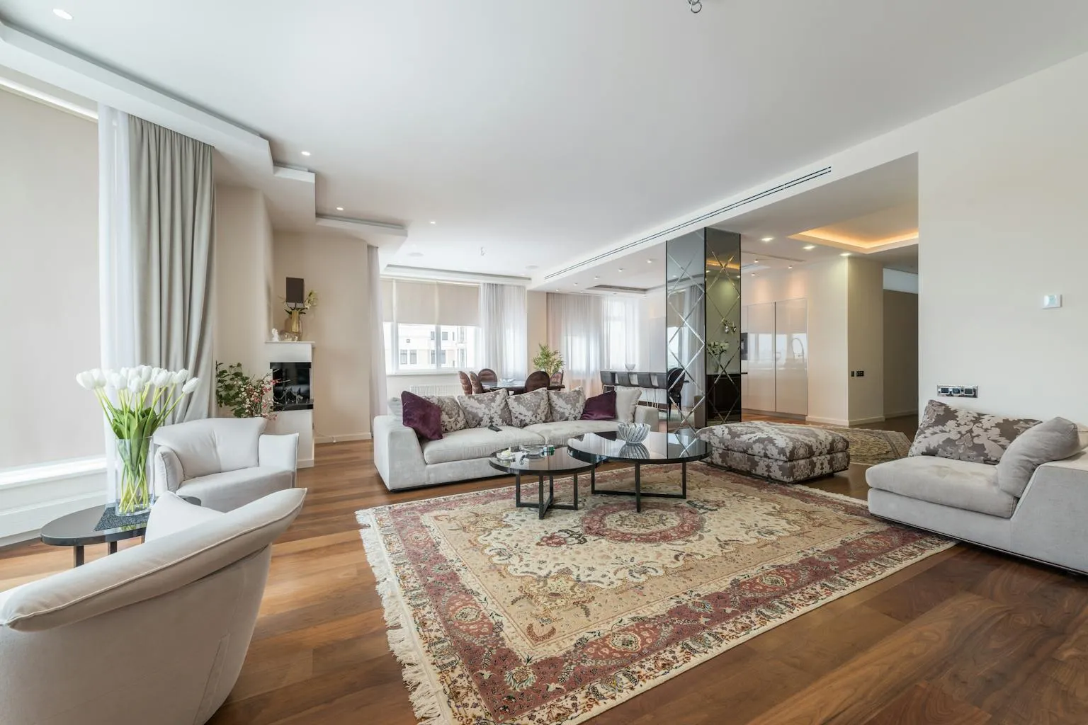 Spacious luxury living room with elegant decor and large windows