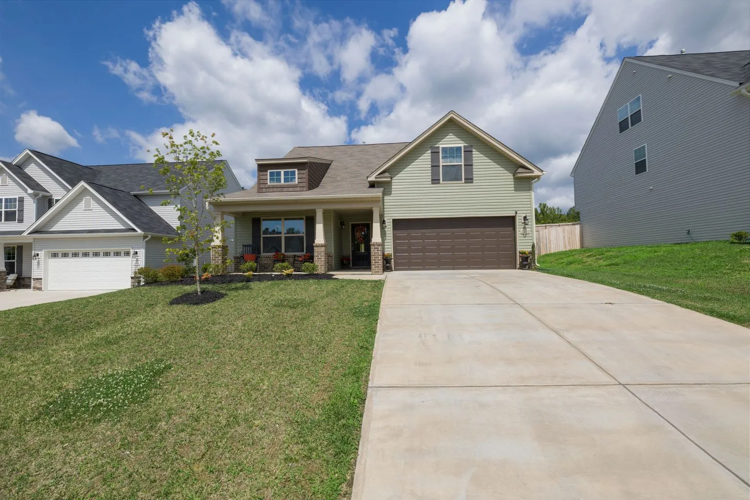 Modern single-story suburban home with wide driveway and accessible entrance