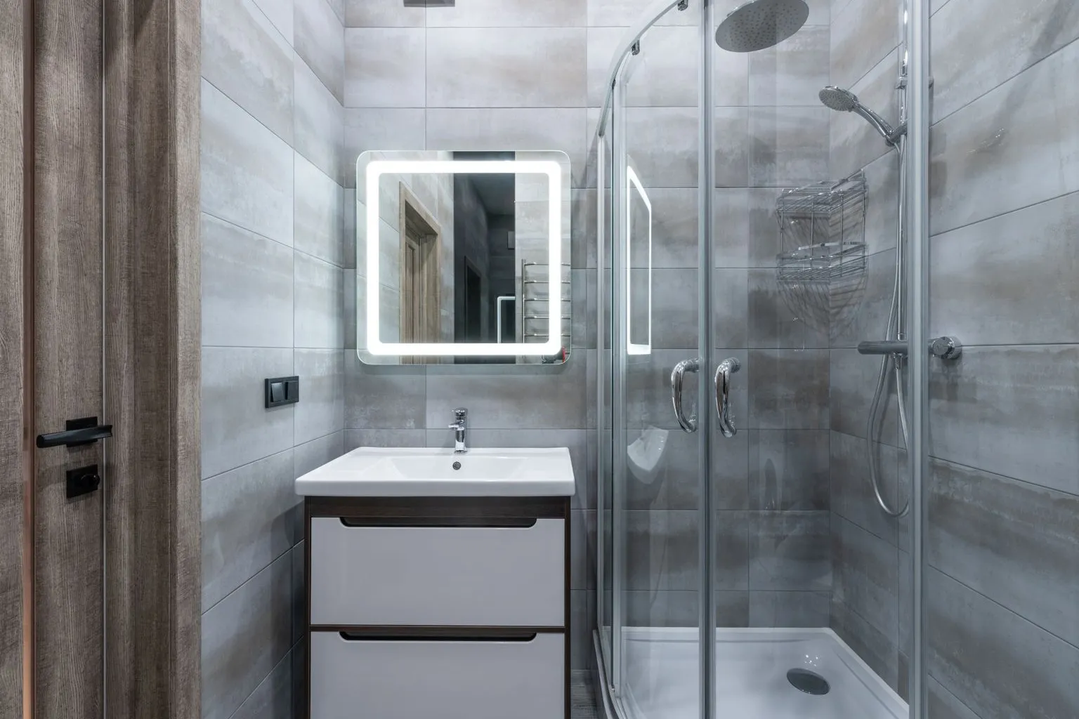 Modern bathroom interior with spacious walk-in shower and clean accessible design