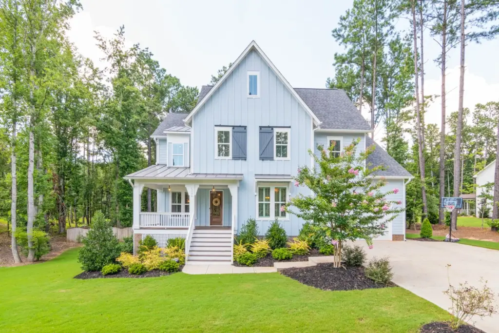 Single-story ranch-style home with covered porch and landscaped front yard in Austin Texas suburb