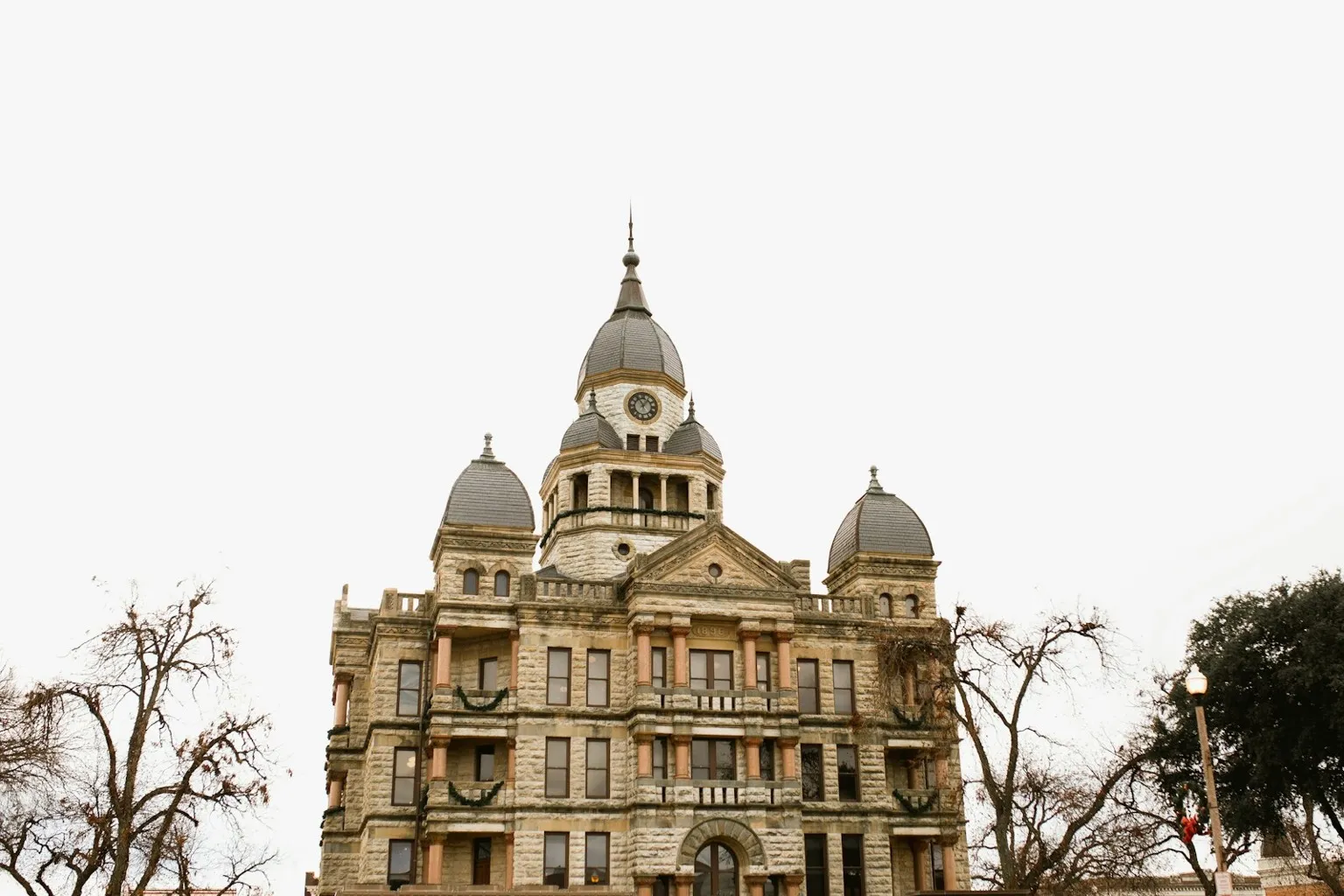 Historic stone Texas county courthouse where first Tuesday foreclosure sales are held