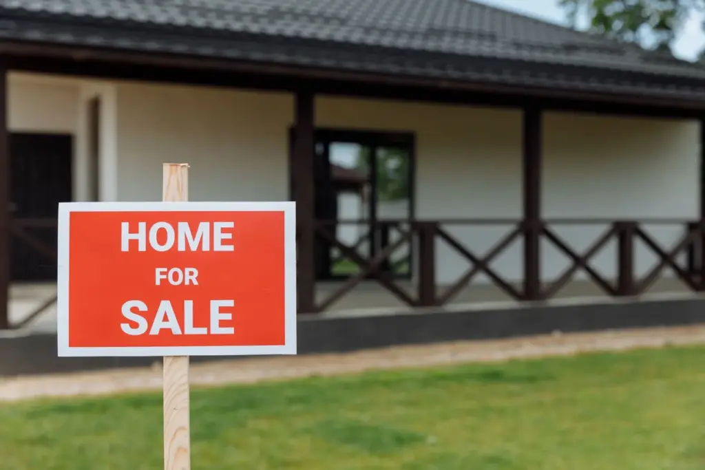 For sale by owner sign in front of a Texas home